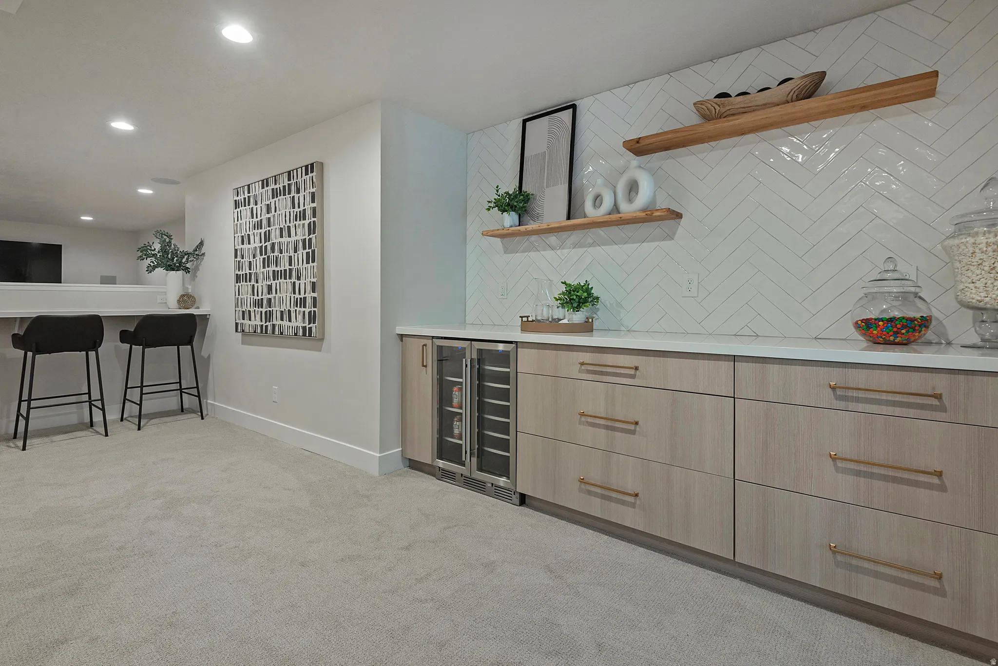 Wet bar with modern cabinets, open shelves, light wood finish cabinets, light carpet, and recessed lighting