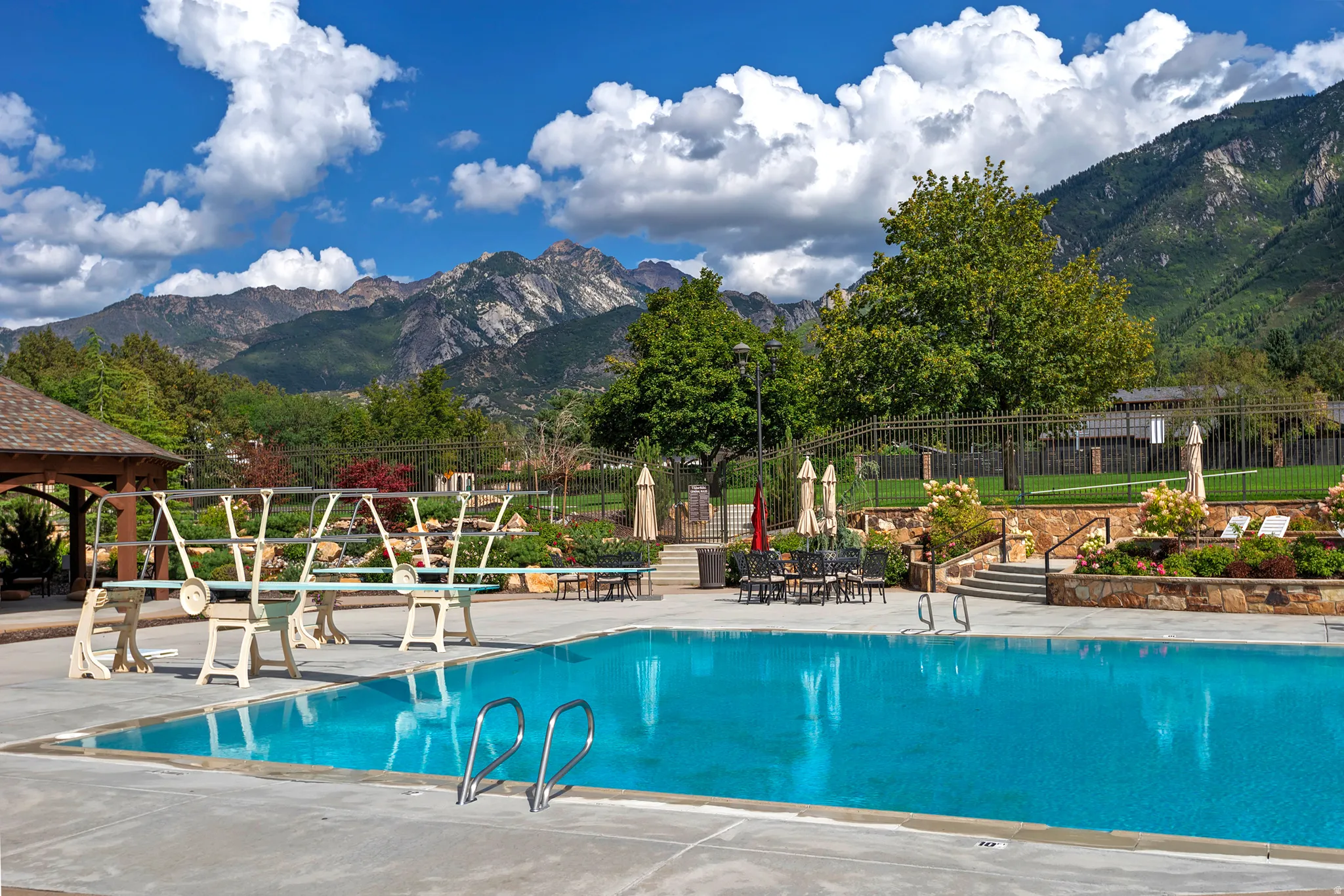 Community pool featuring a patio and a mountain view