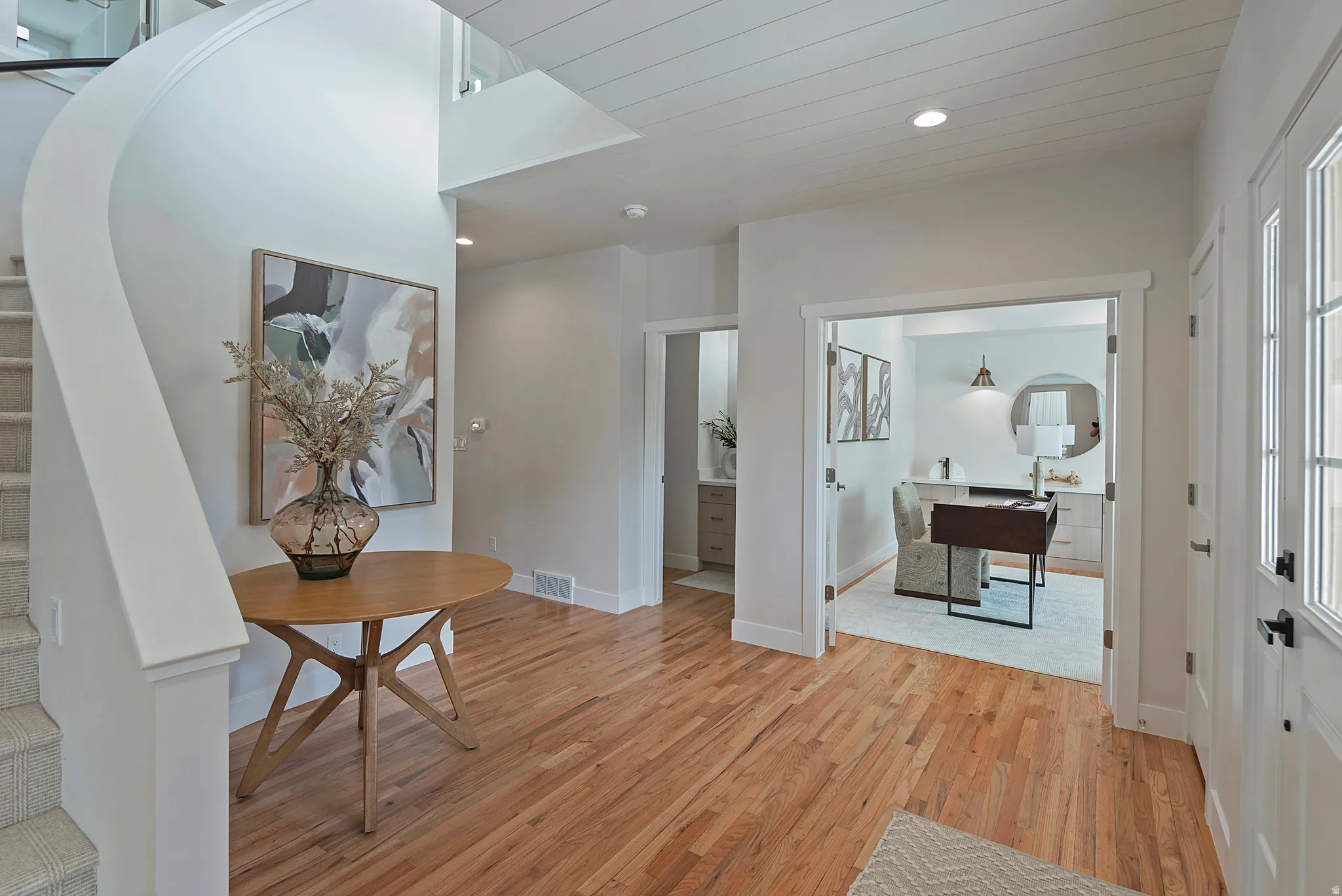 Entryway featuring light wood-type flooring and recessed lighting