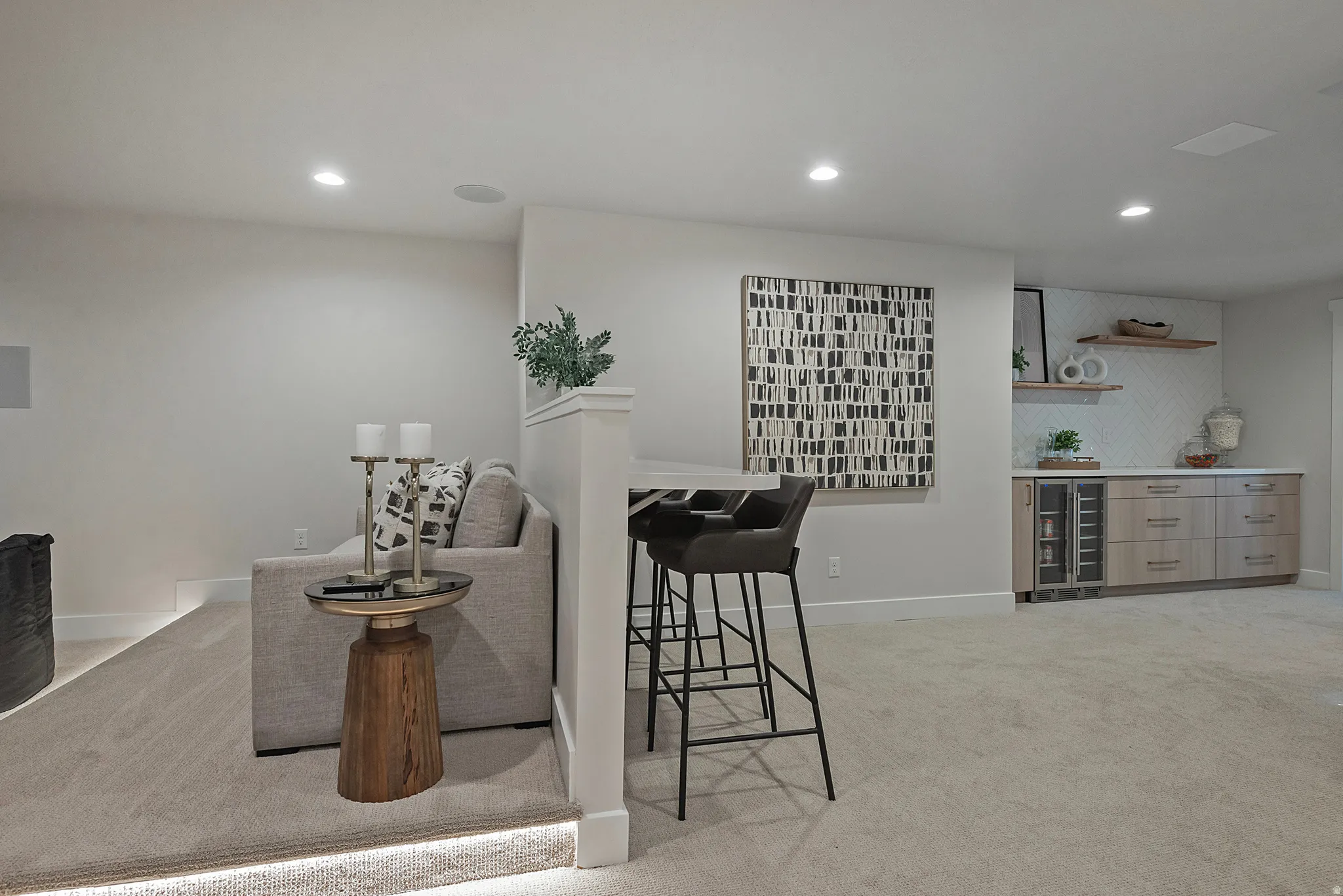 Living room with light colored carpet, recessed lighting, a dry bar, and beverage cooler