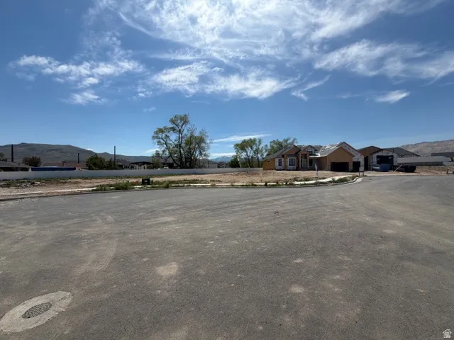 Expansive undeveloped lot featuring a level grade and distant mountain range