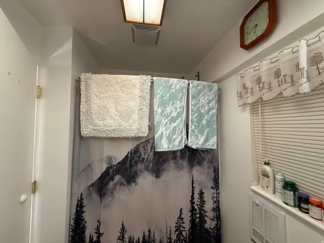 White walls and a privacy window blind