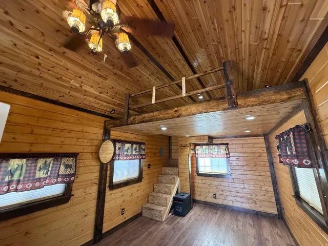 Wood-finish flooring with horizontal wood paneling throughout