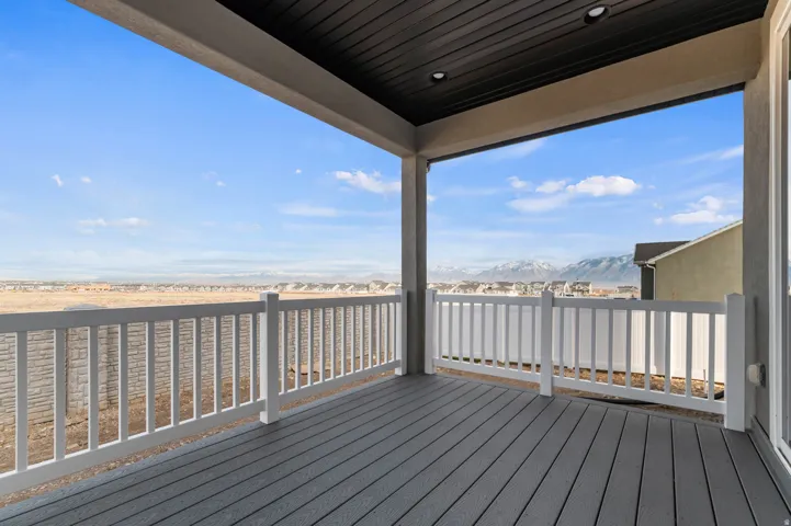 Covered outdoor deck with composite wood-finish flooring