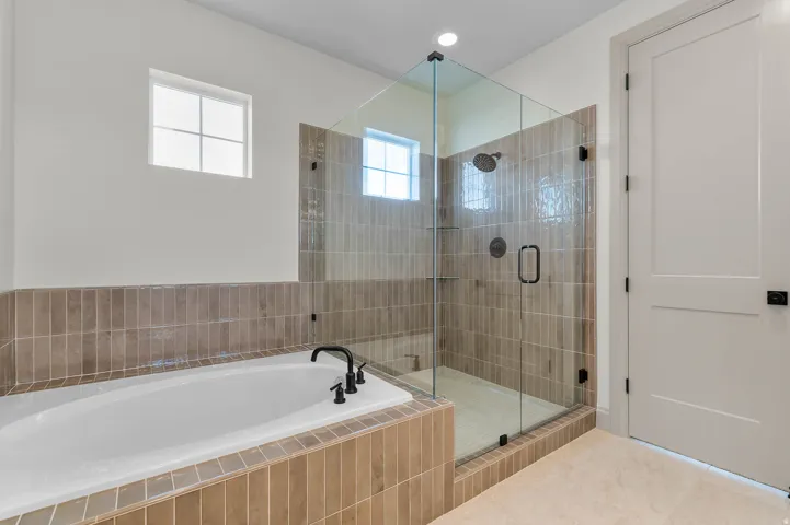 Soaking tub with matte black fixtures