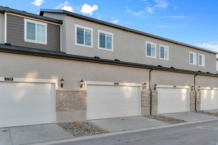 Contemporary townhome-style residences featuring stucco and siding exteriors