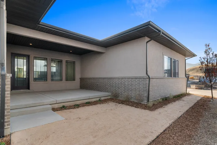 Covered patio featuring recessed lighting
