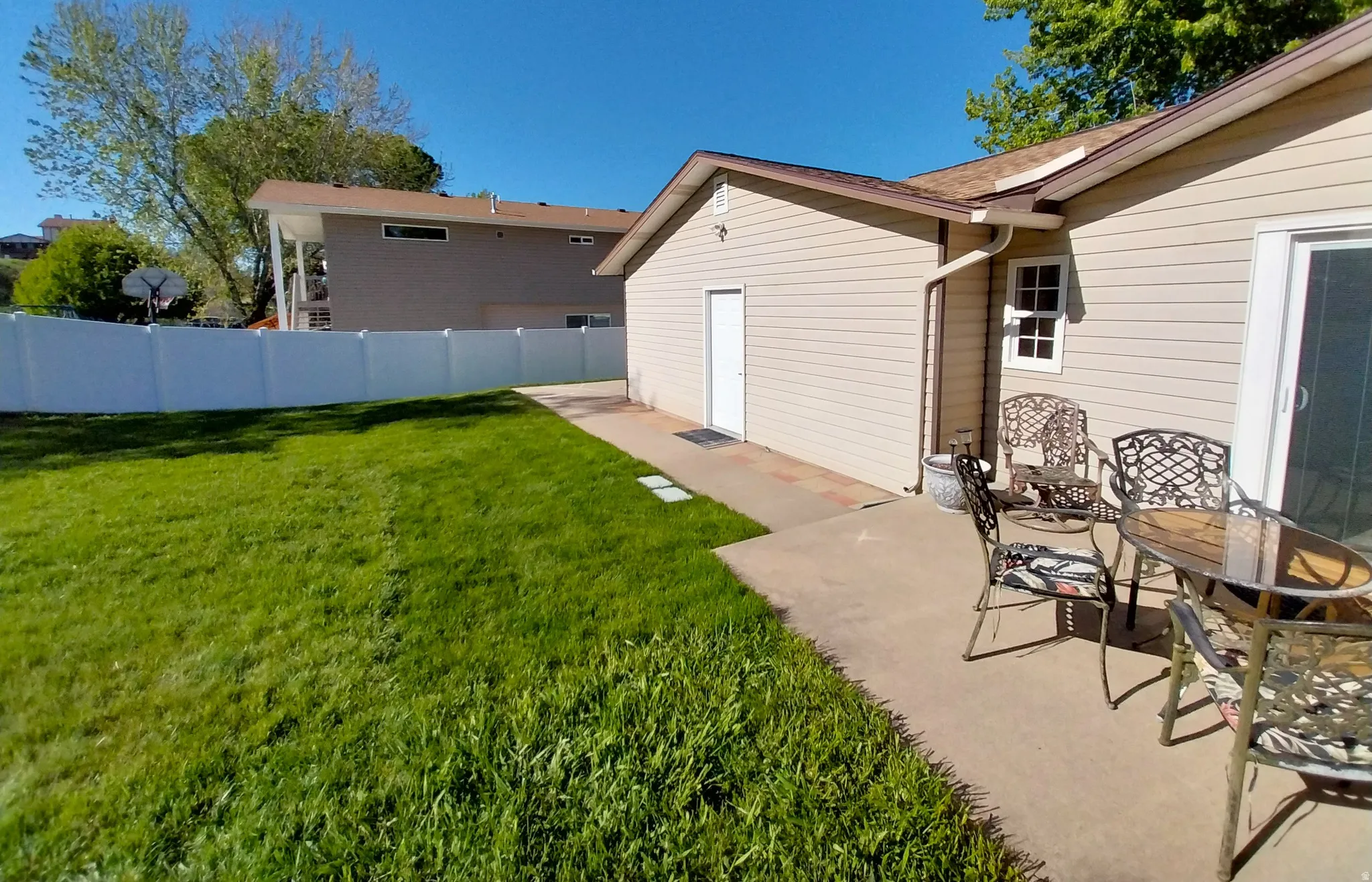 Fenced yard with a patio