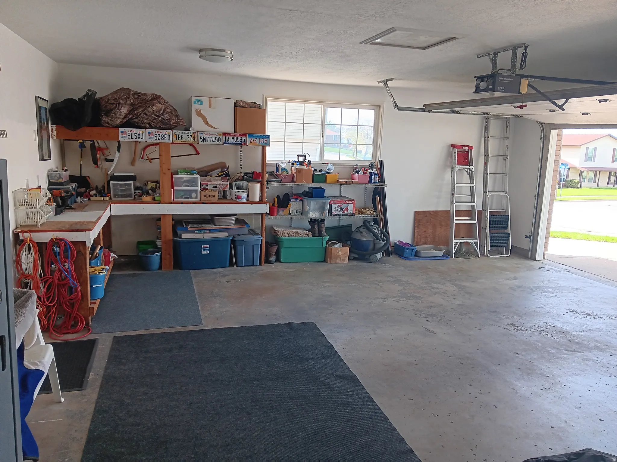 Garage featuring a garage door opener