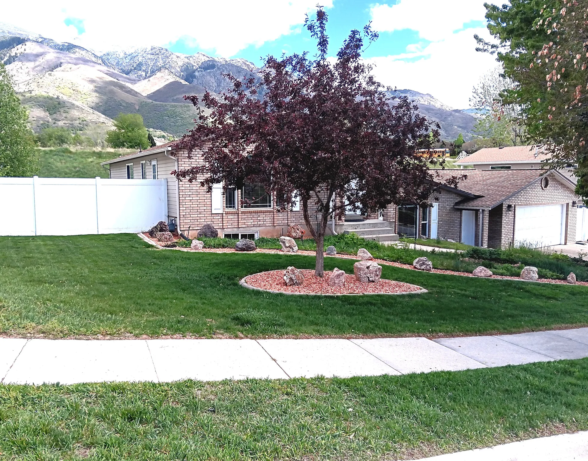 View of front facade featuring a mountain view and brick siding