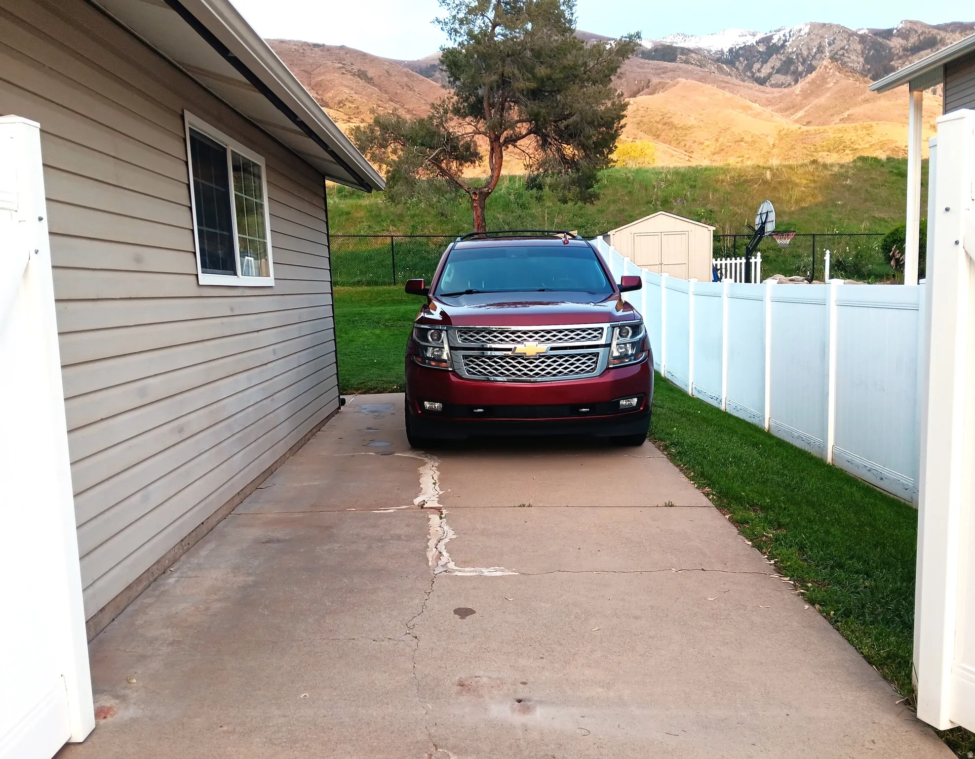 View of gated RV parking with a mountain view