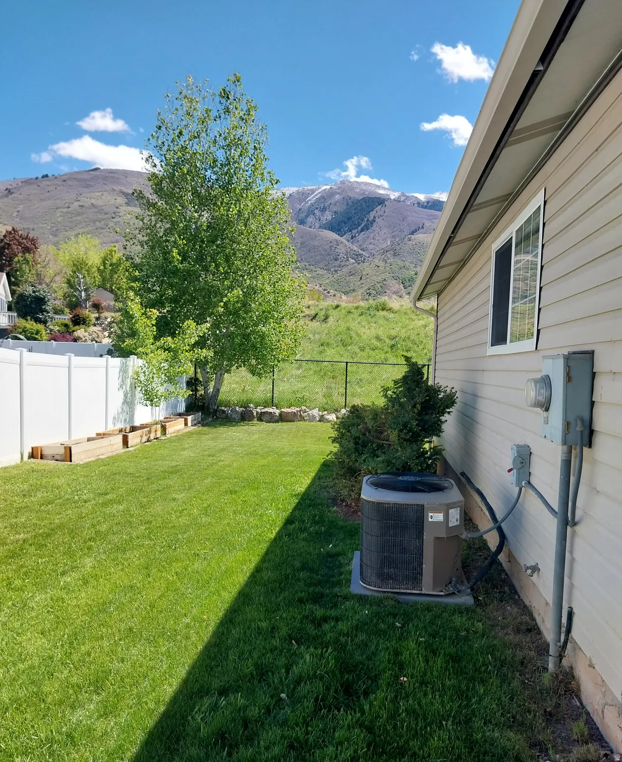 North facing backyard with an AC unit