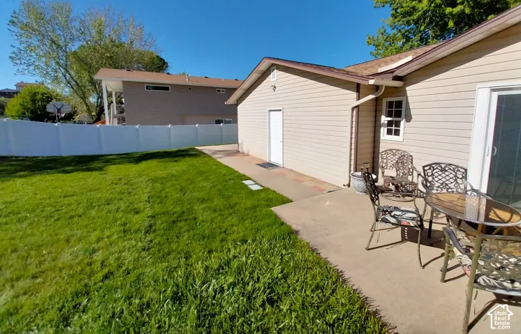 Fenced yard with a patio
