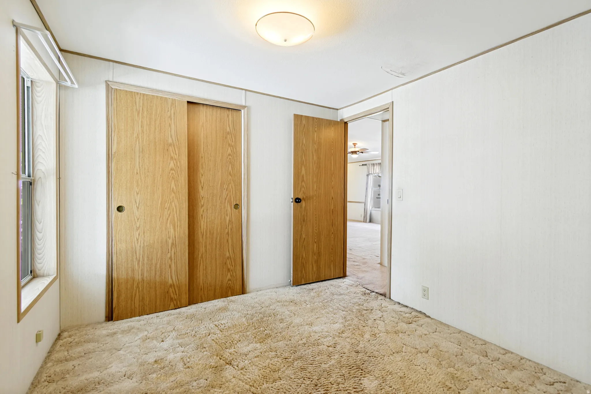 Unfurnished bedroom featuring a closet and carpet flooring