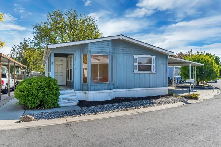 View of front of home featuring an attached carport