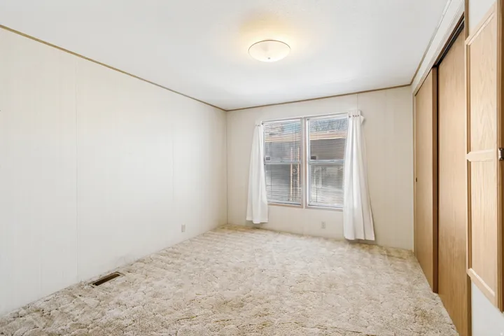 Unfurnished bedroom featuring carpet flooring