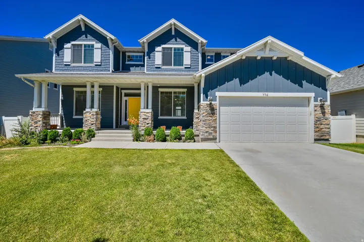 Contemporary two-story residence featuring blue siding and white trim