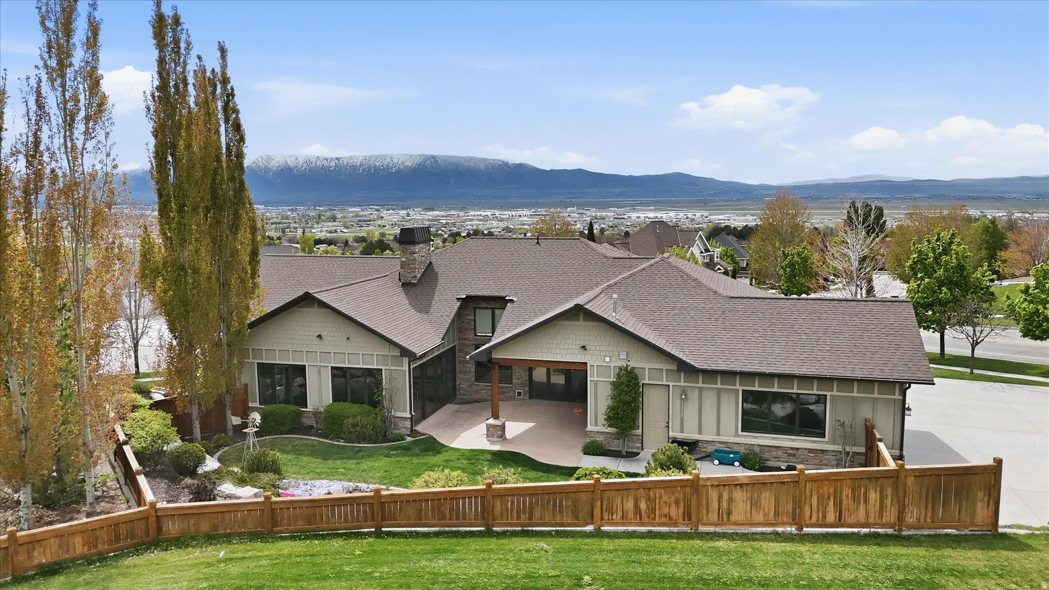 Craftsman-style exterior with a covered patio and a wood beam accent