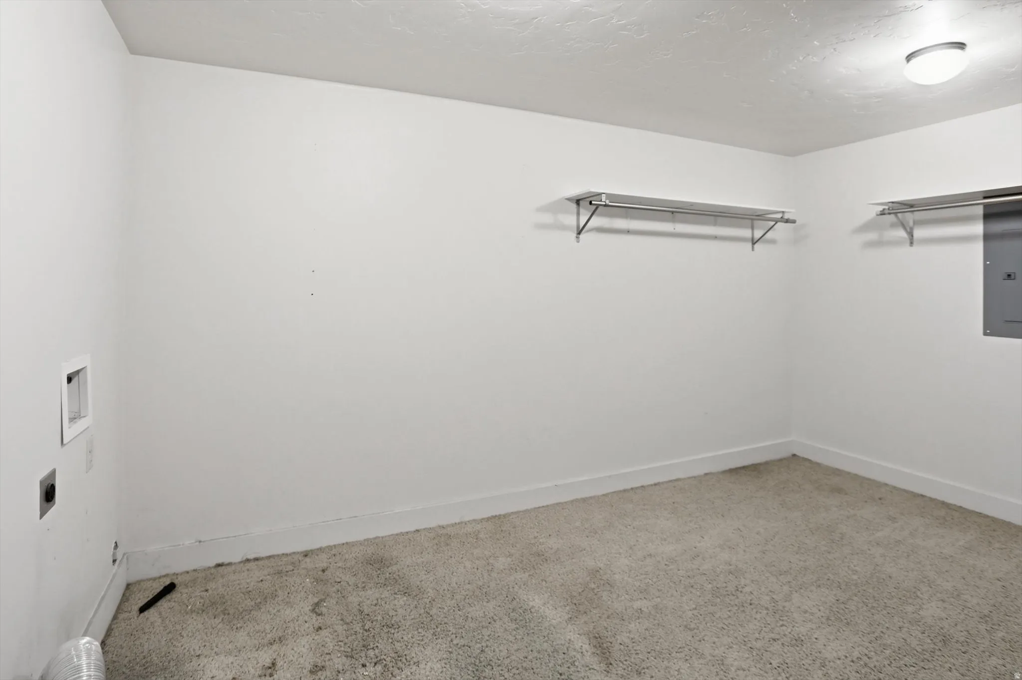 Dedicated laundry area with wall hookups for appliances
