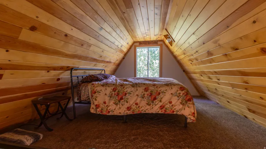 Vaulted ceiling featuring natural wood paneling
