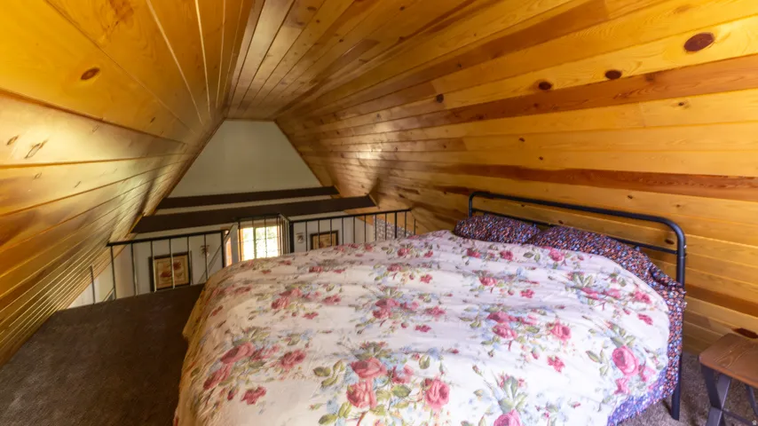 Vaulted wood-paneled ceiling with exposed beams