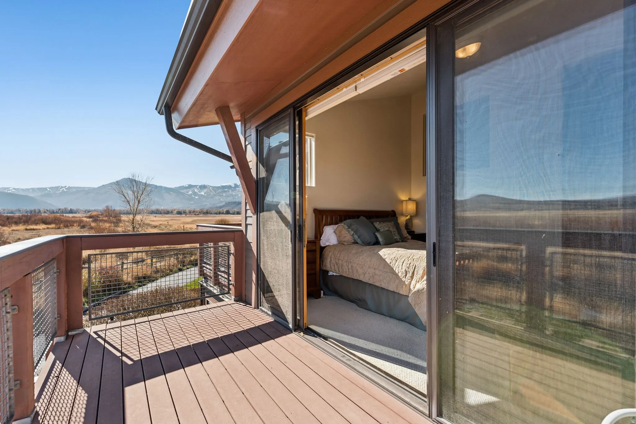Expansive exterior deck featuring composite decking and metal railings