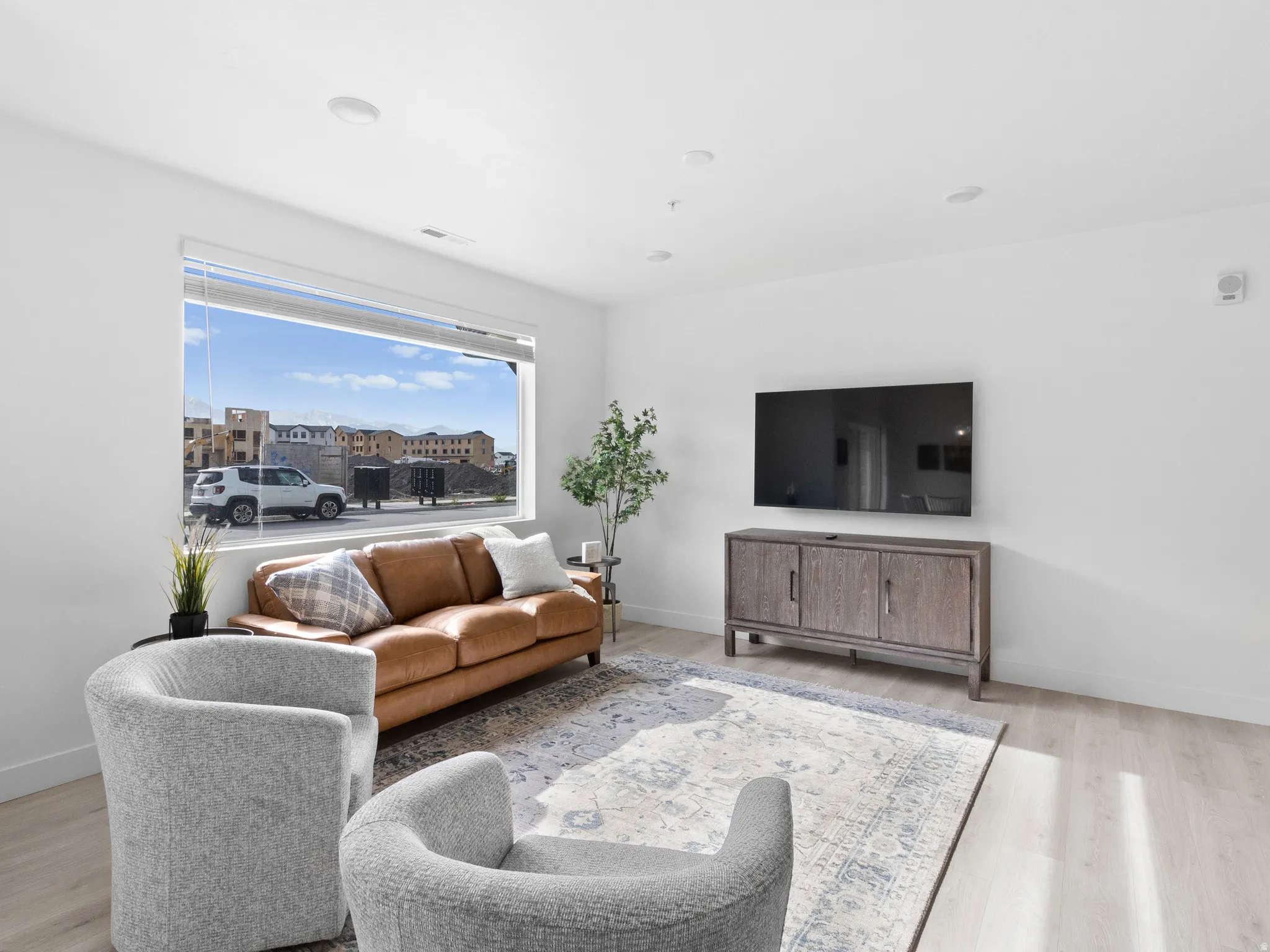 Living room with light wood-type flooring