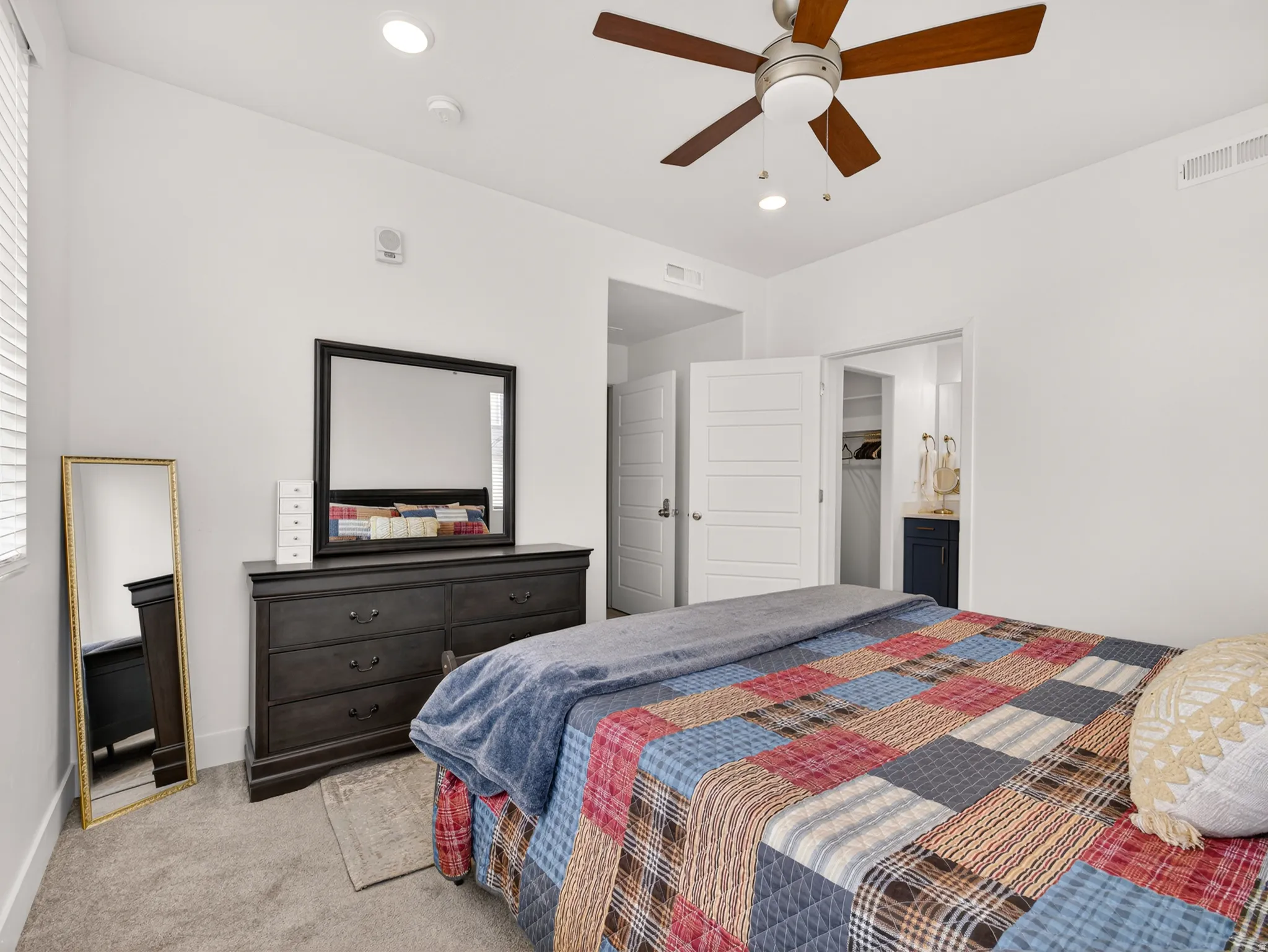 Bedroom featuring a ceiling fan with integrated lighting, recessed lighting, and soft carpet flooring