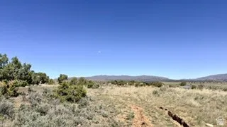 View of mountain backdrop with rural landscape