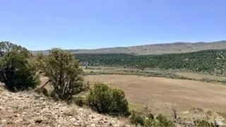 View of mountain background featuring rural landscape and farmland