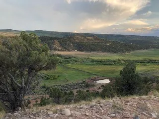 View of mountain backdrop with rural landscape