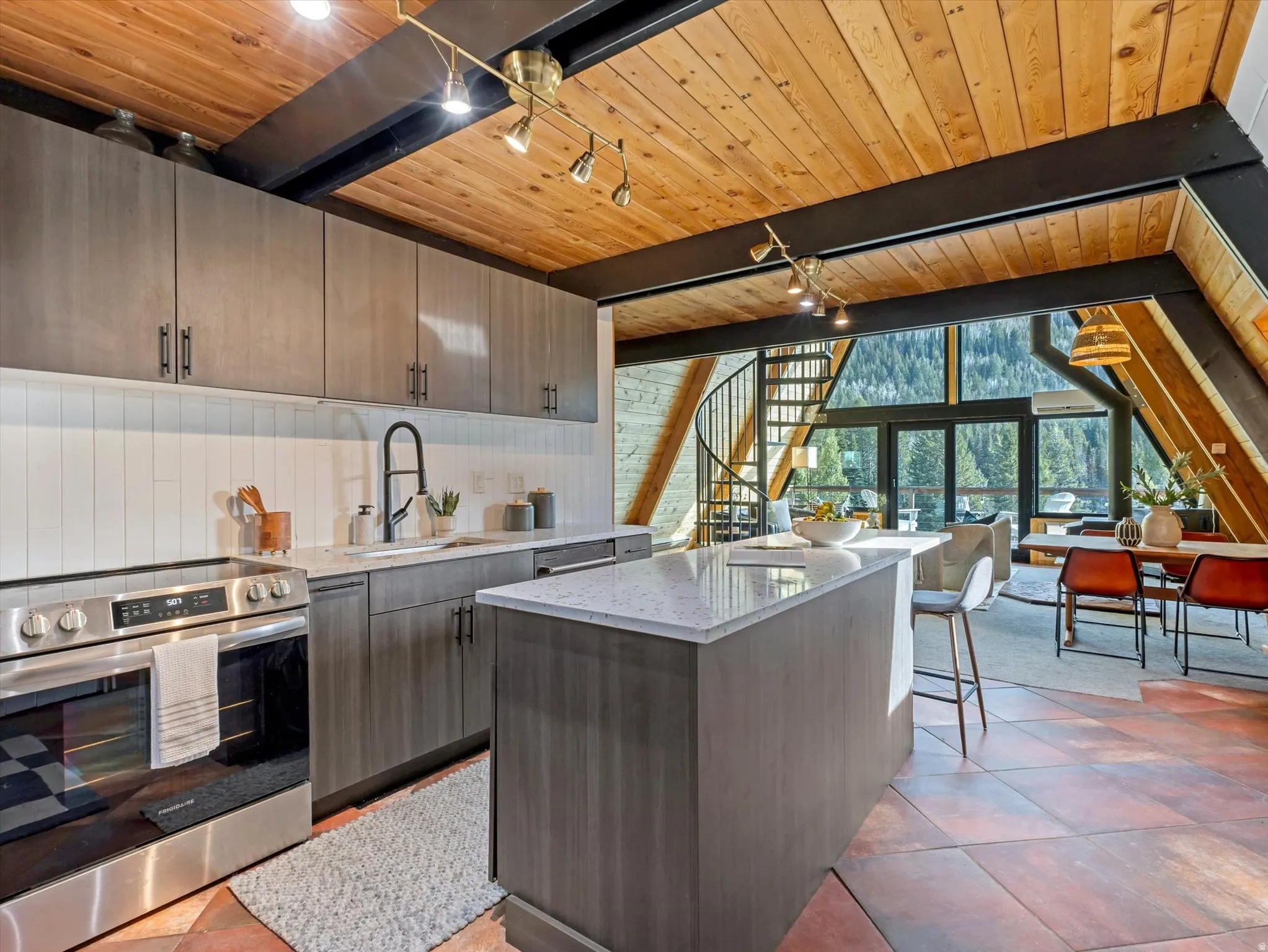 Kitchen with electric range, a center island, a wood ceiling with exposed beams, light stone counters, and modern cabinets