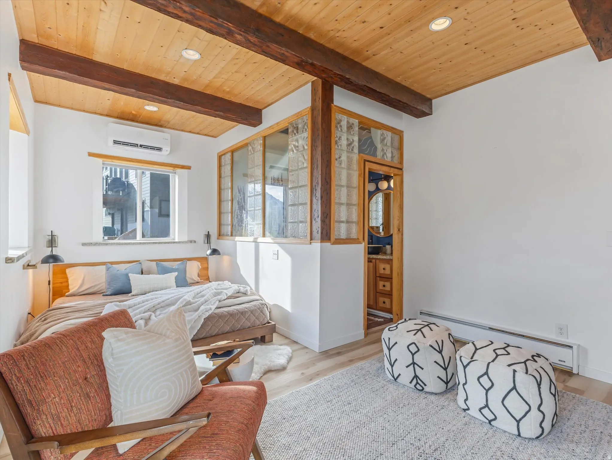 Bedroom with recessed lighting, a baseboard heating unit, wood finished floors, and a wood ceiling with exposed beams