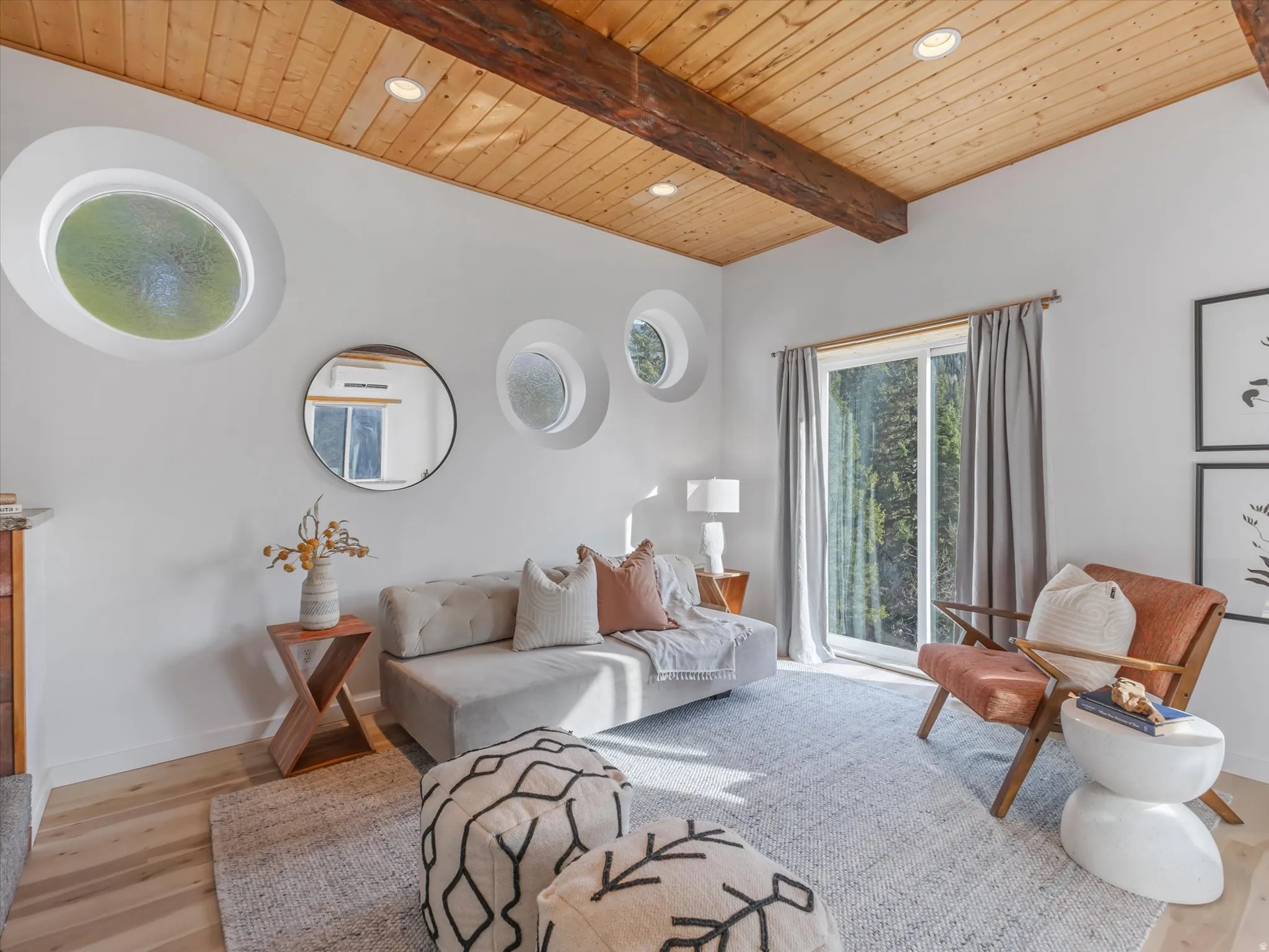 Living room featuring recessed lighting, a wood ceiling with exposed beams, and light wood-style floors
