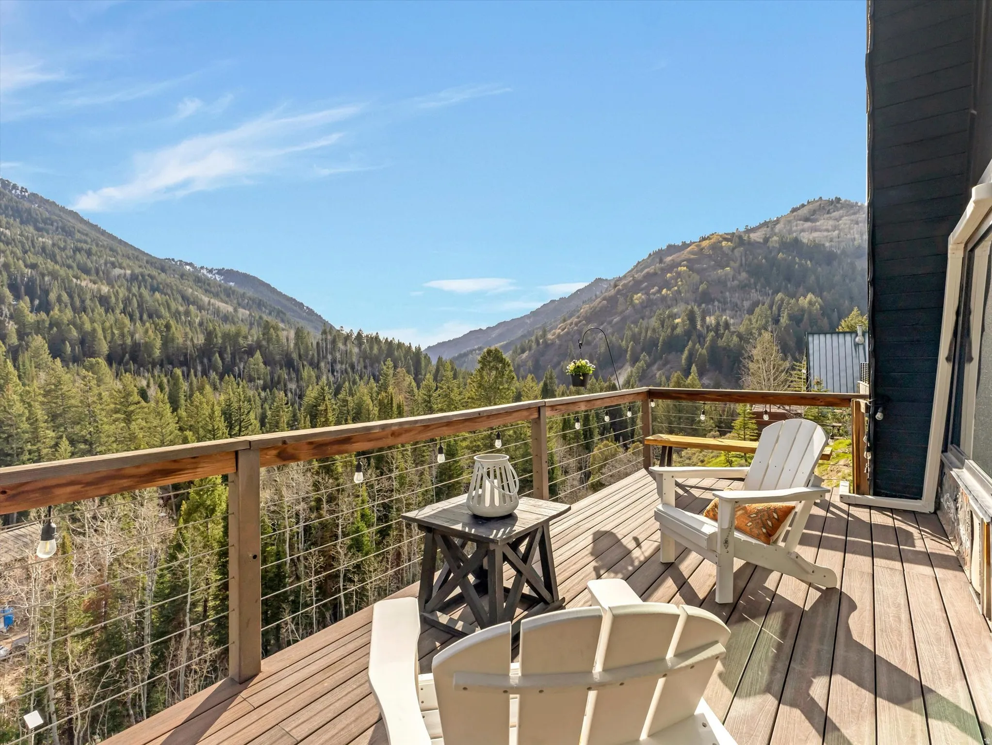 Deck featuring a view of trees and a mountain view