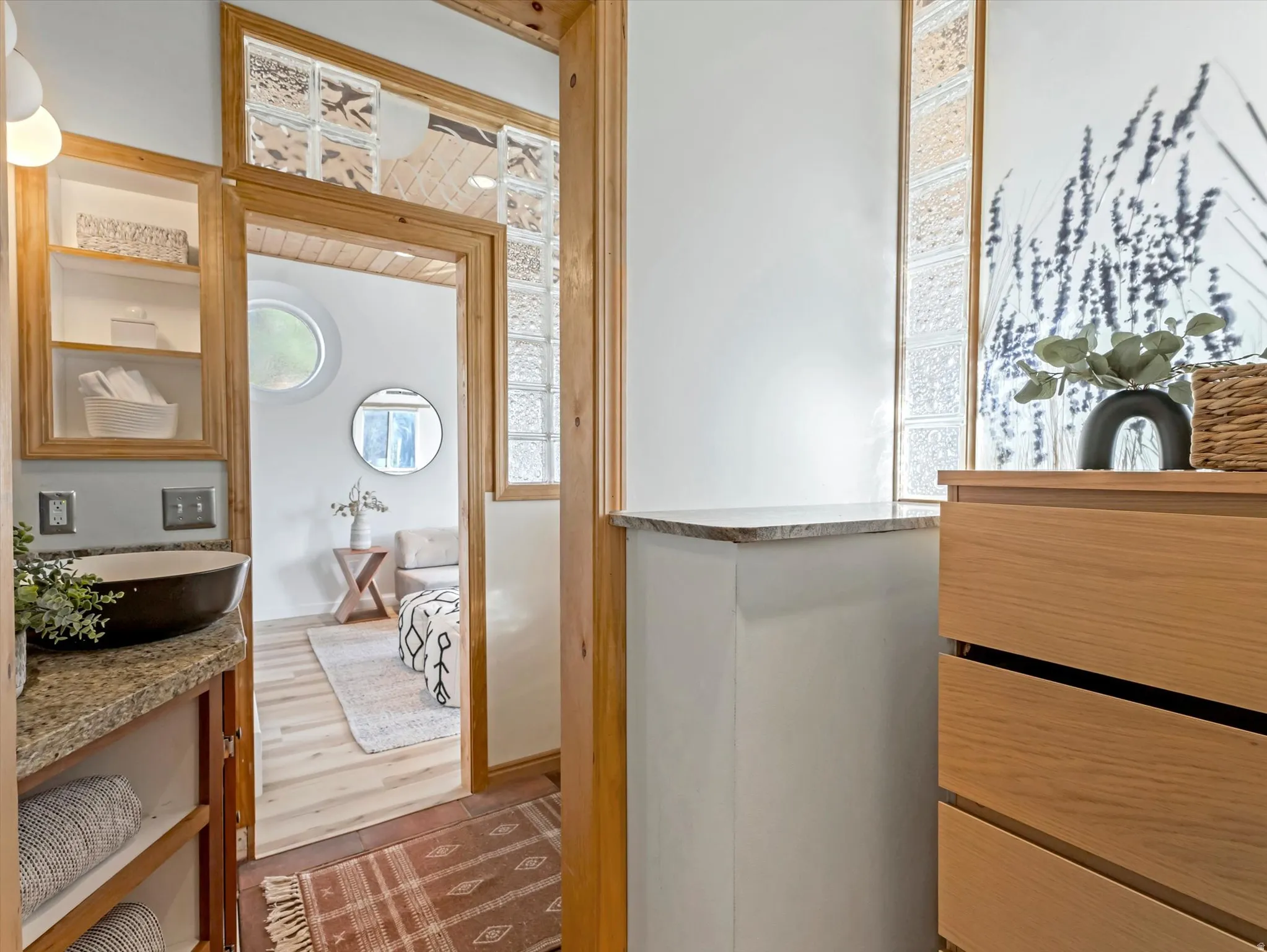 Bathroom featuring vanity and wood finished floors