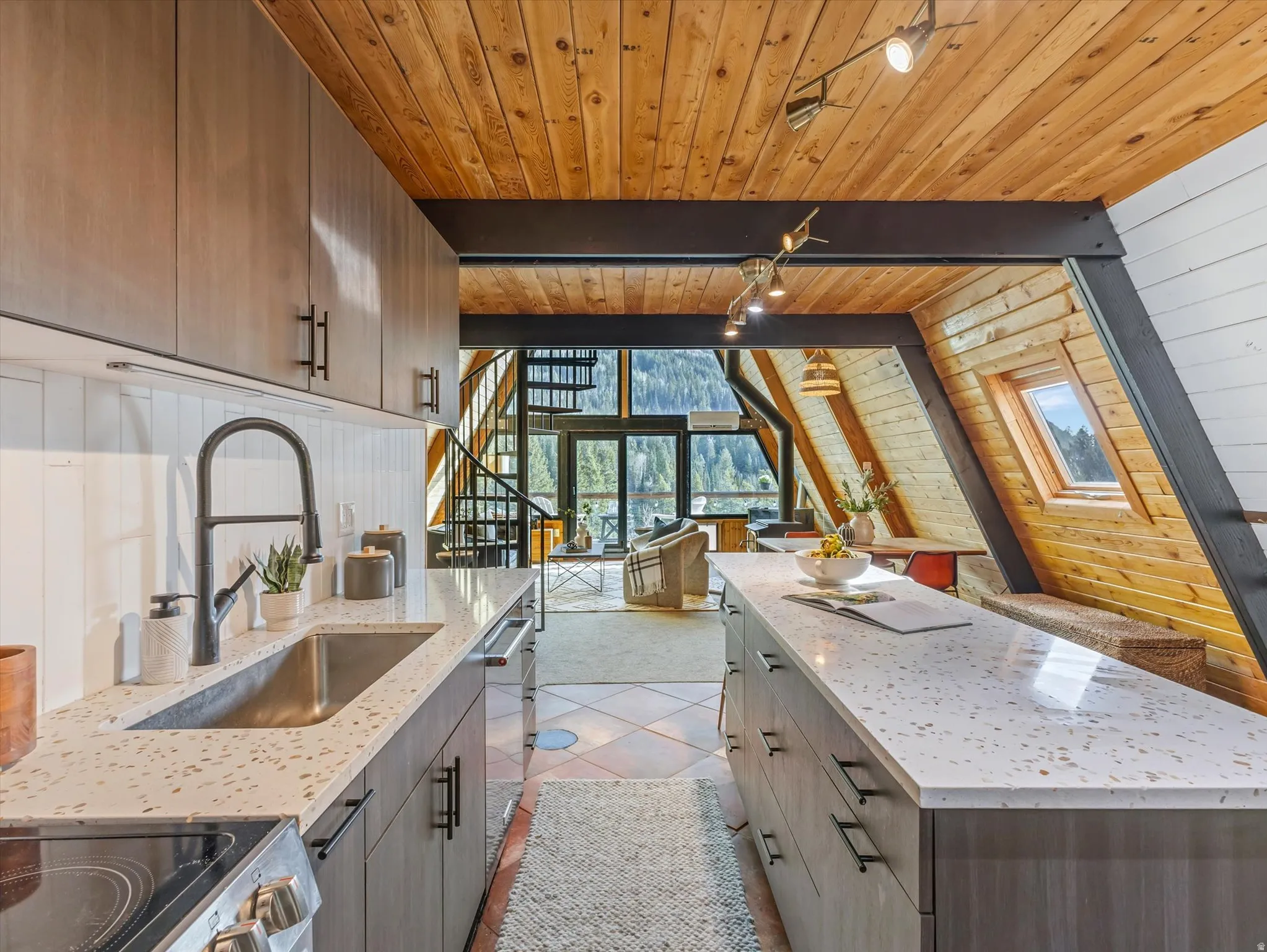 Kitchen featuring wood walls, light stone counters, modern cabinets, light tile patterned flooring, and a wooden ceiling with exposed beams