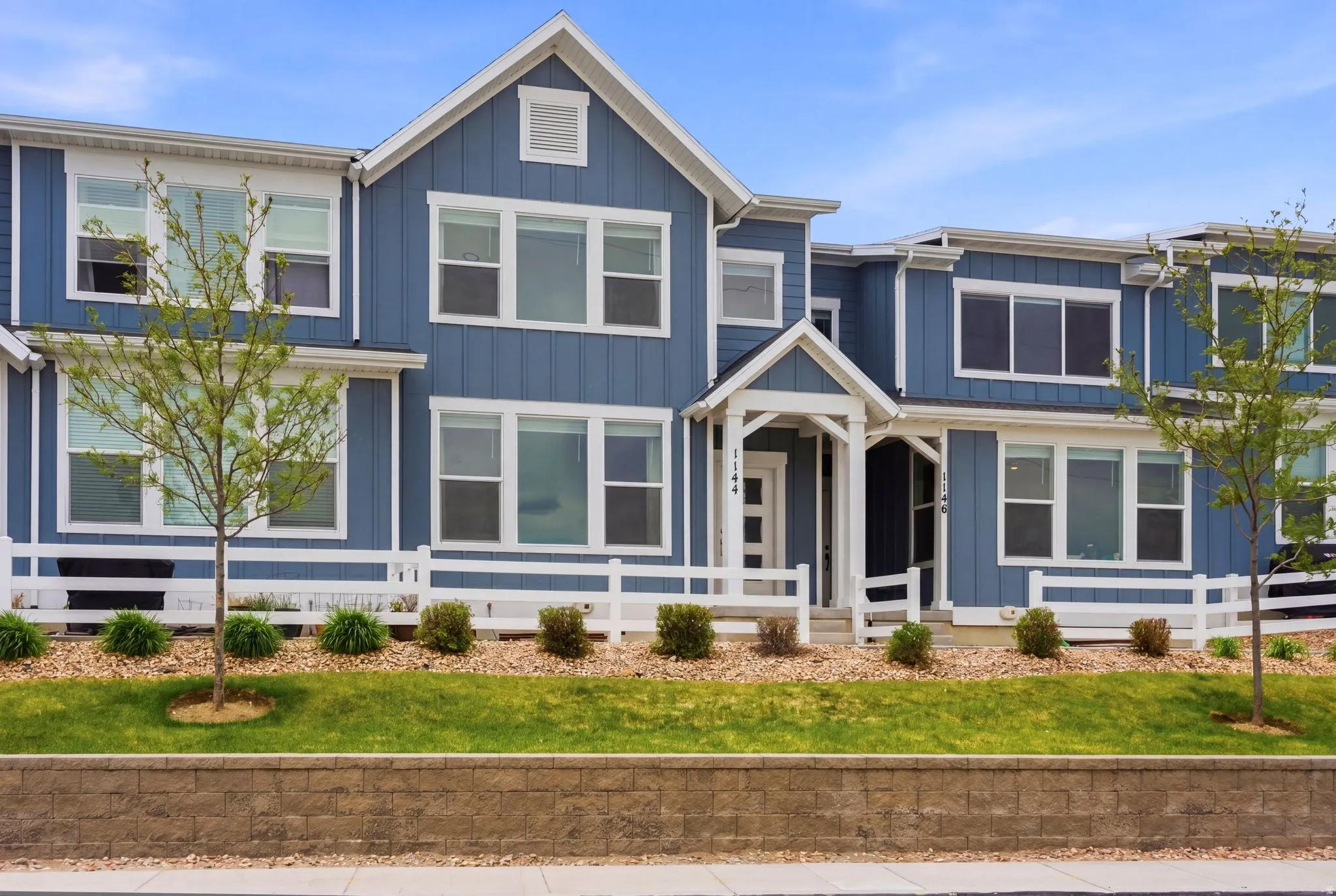 Blue vertical siding exterior with white trim
