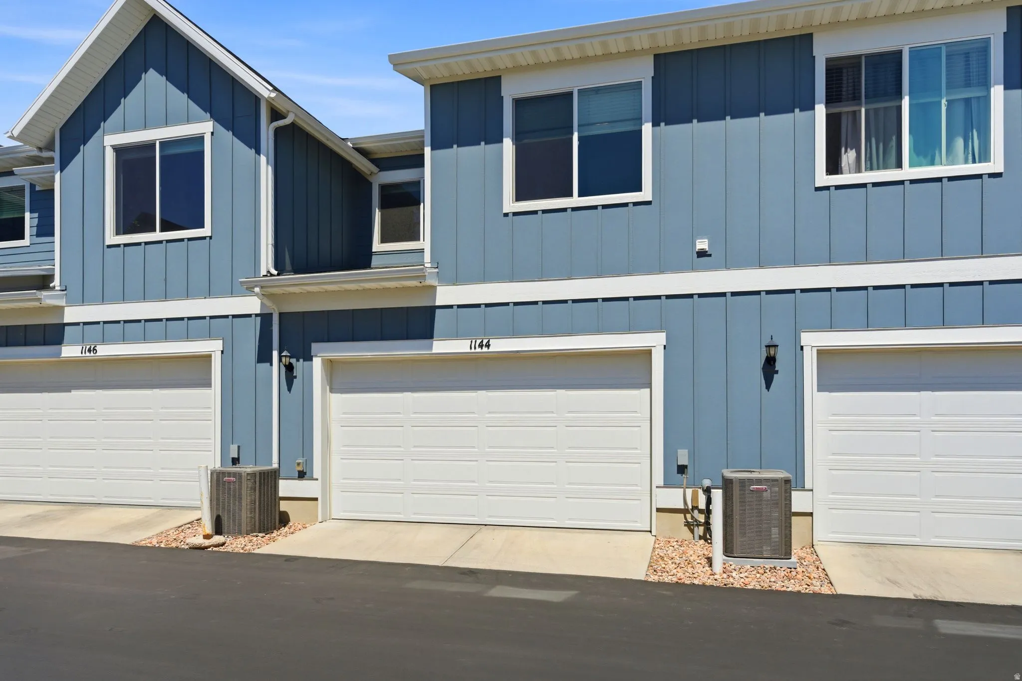 Blue vertical siding exterior with white trim