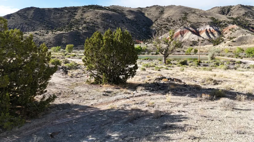 Expansive undeveloped land featuring natural terrain and distant mountains