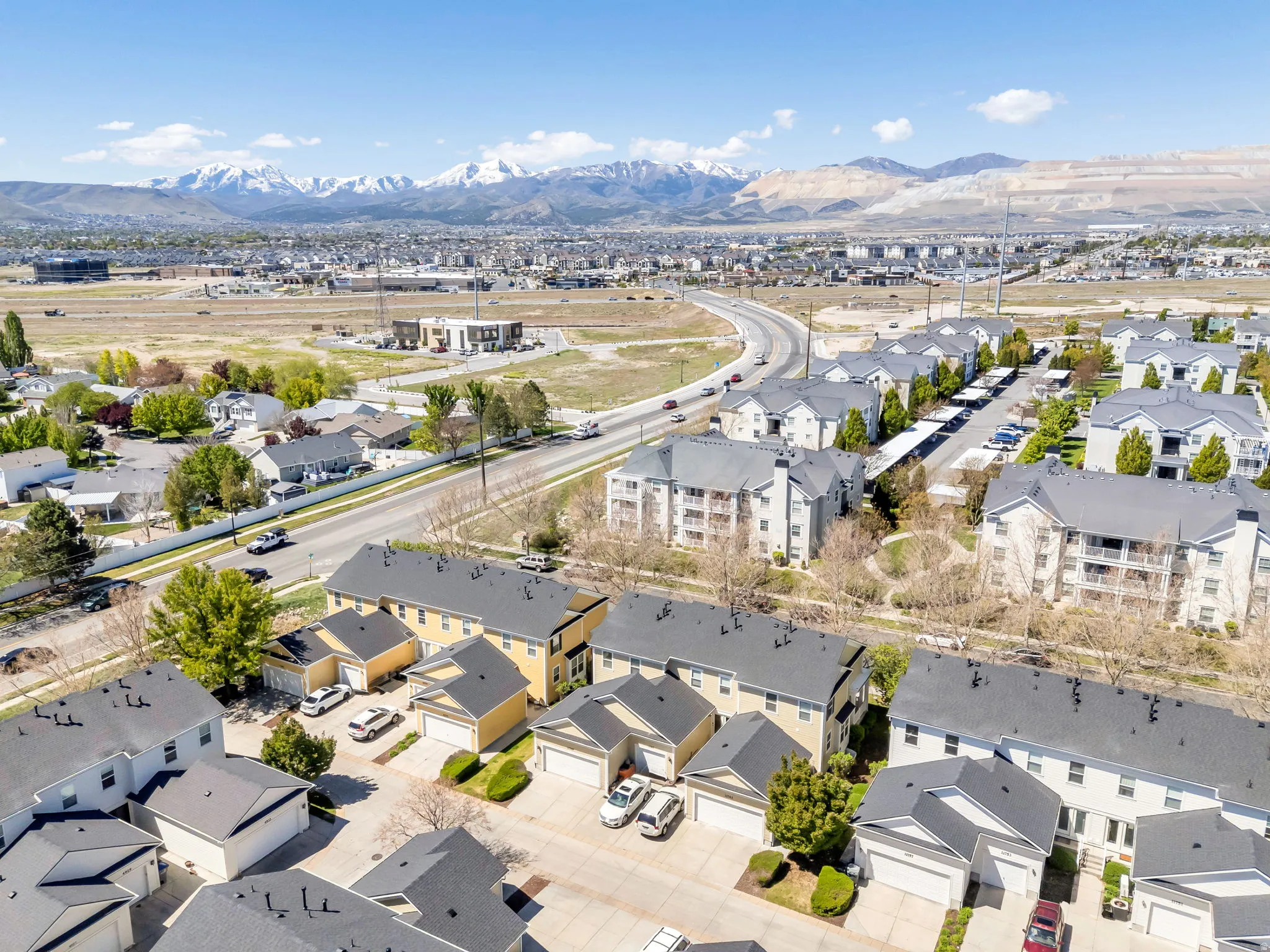Aerial perspective of suburban area featuring a mountain backdrop