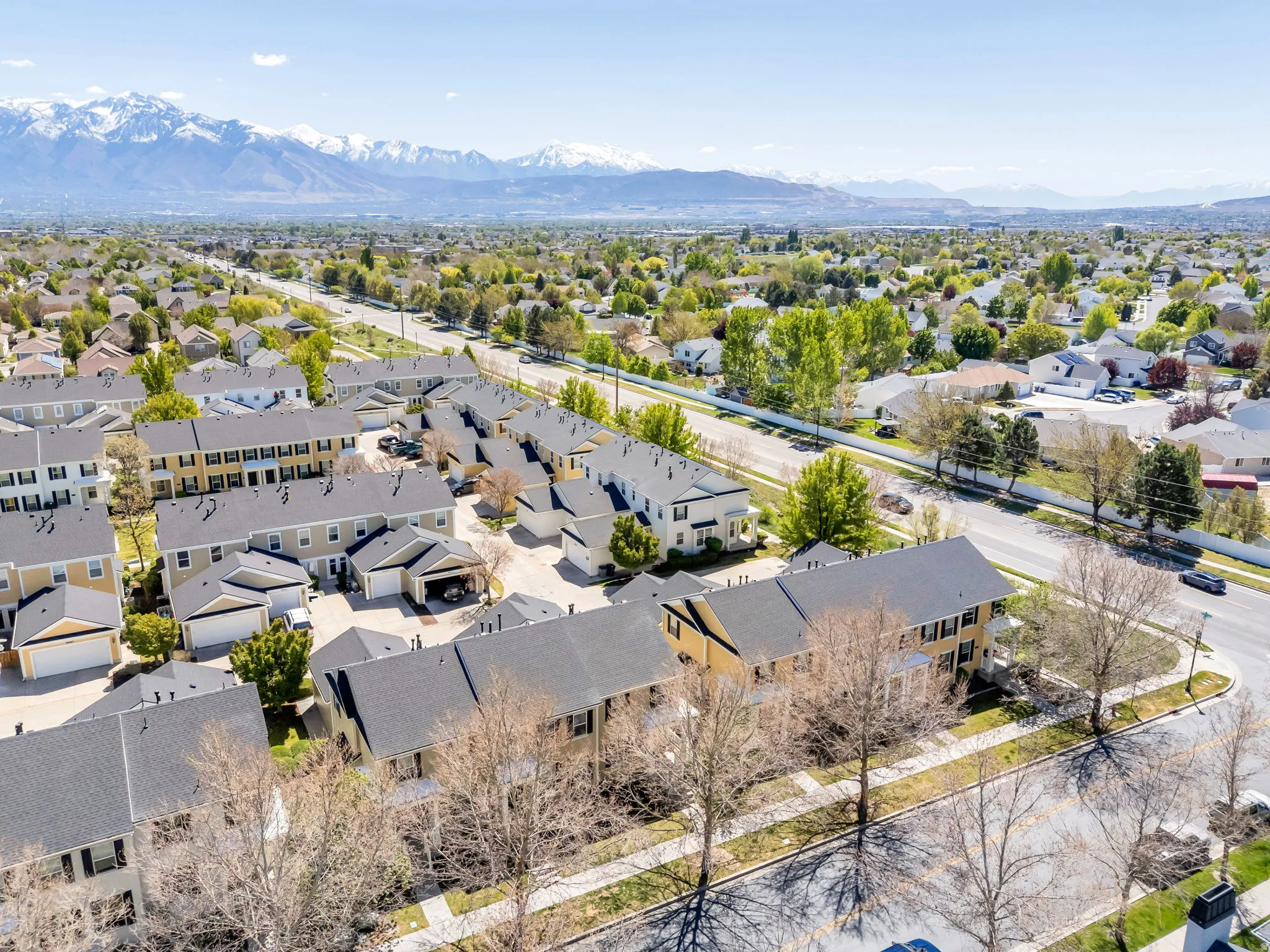 Aerial perspective of suburban area with a mountain backdrop