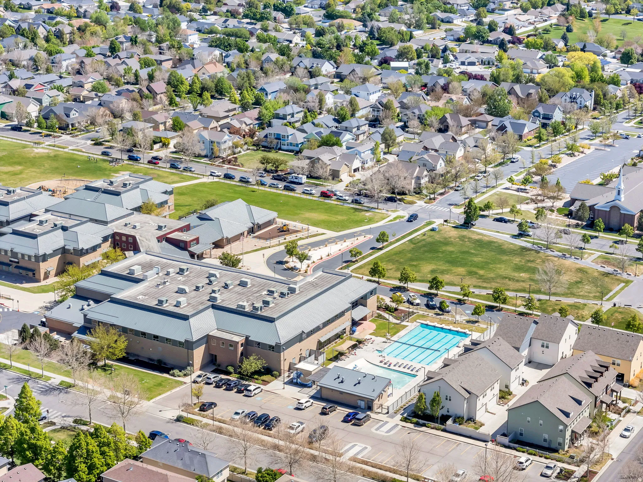 Aerial view of property's location with nearby suburban area