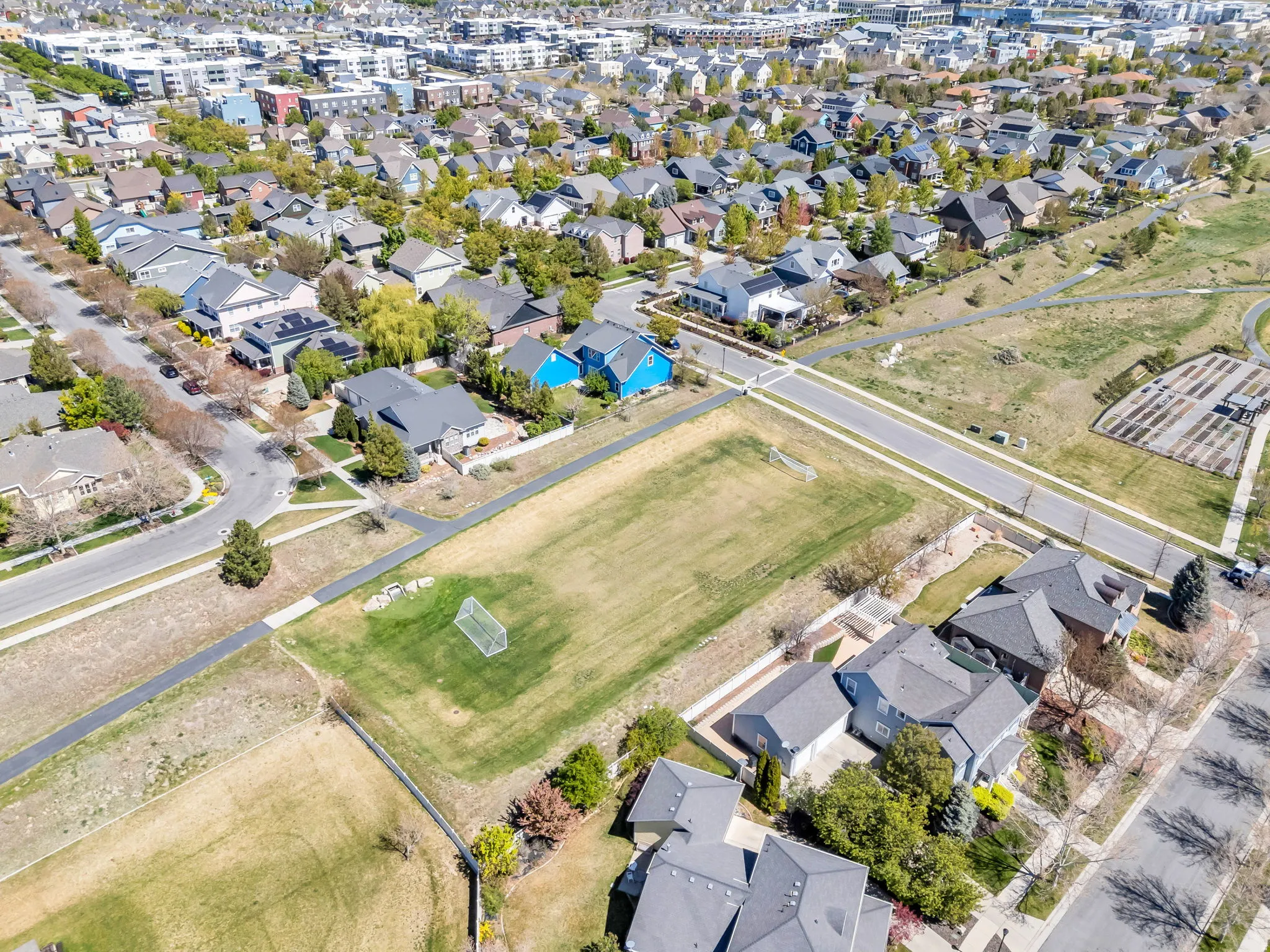 Aerial view of property's location featuring nearby suburban area