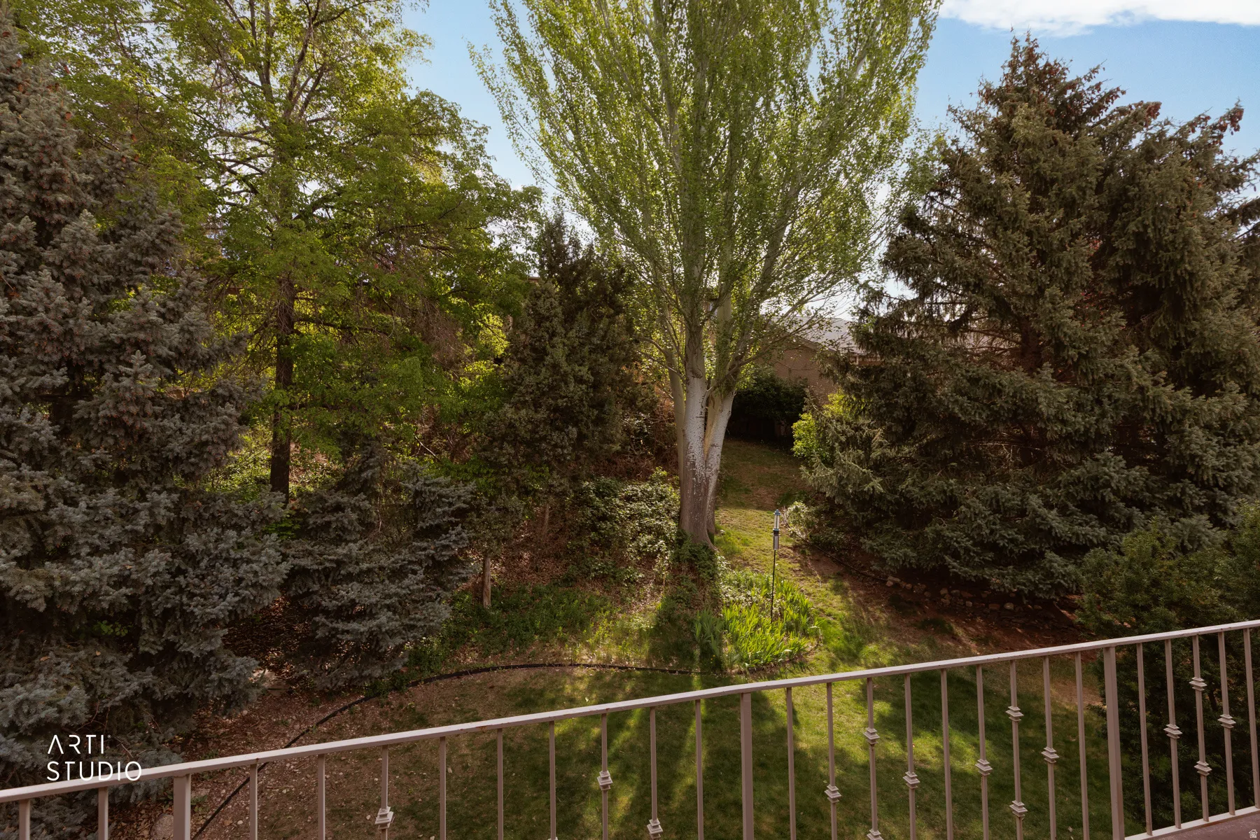 Mature landscaping featuring diverse trees and shrubs, creating a private outdoor environment