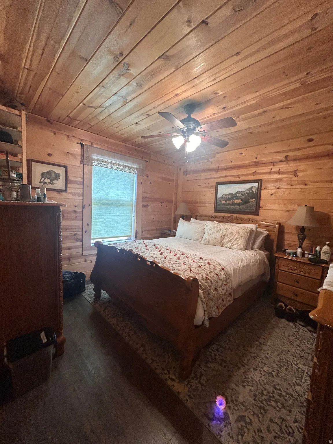 Wood-paneled walls and ceiling creating a cabin-like atmosphere