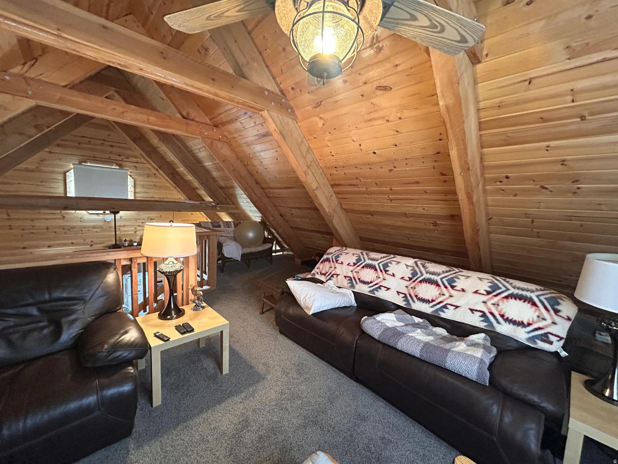 Vaulted wood-paneled ceilings with exposed wood beams