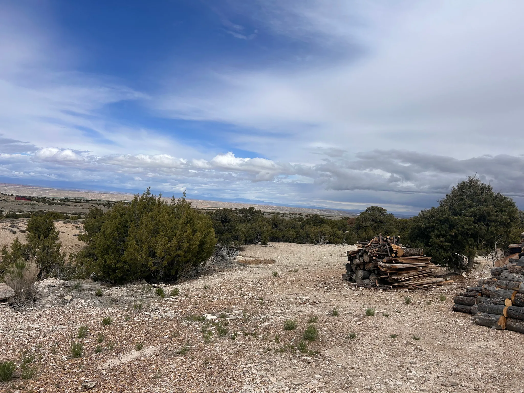 Expansive outdoor area featuring varied terrain with natural rock and sparse vegetation