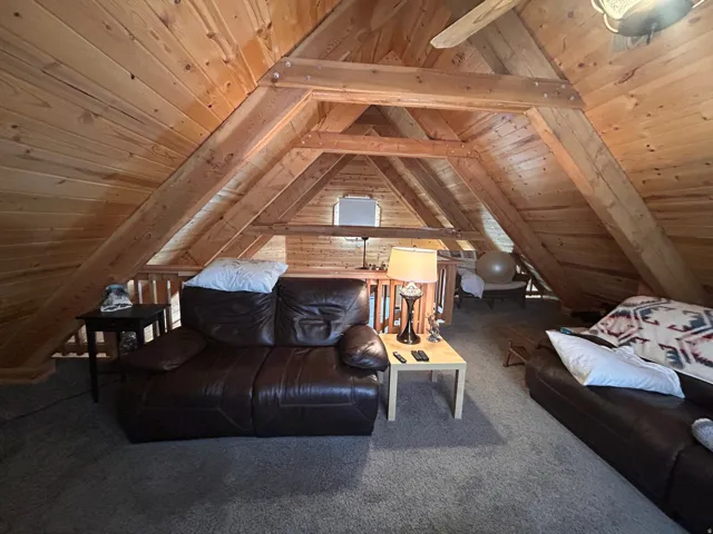 Vaulted wood-paneled ceiling with exposed beams