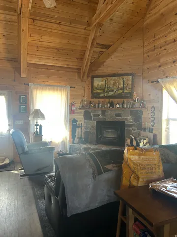 Vaulted wood-paneled ceiling with exposed beams